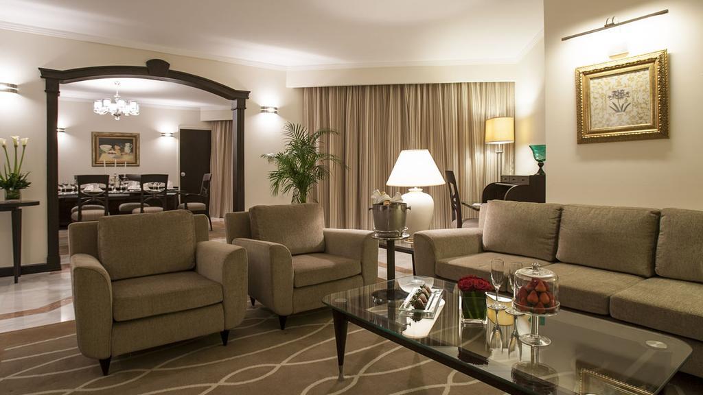 Danat Al Ain Resort Ngoại thất bức ảnh A living room in a suite at the Taj Mahal Palace, Mumbai